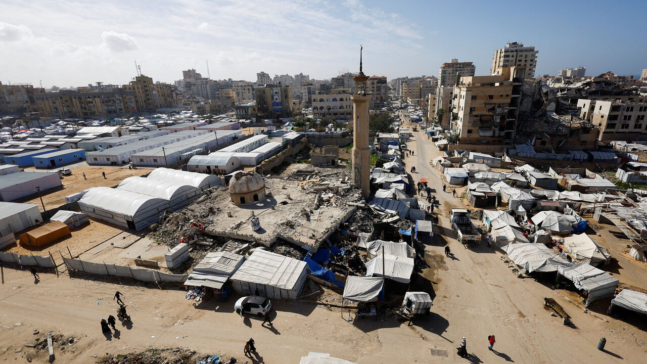 A mosque, destroyed during the two-year Israeli offensives, is surrounded by tents for displaced Palestinians, in Gaza City, February 11, 2026. REUTERS/Mahmoud Issa