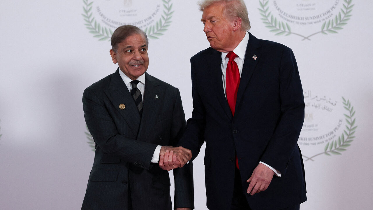 FILE PHOTO: U.S. President Donald Trump and Pakistani Prime Minister Shehbaz Sharif shake hands as they pose for a photo, at a world leaders' summit on ending the Gaza war, amid a U.S.-brokered prisoner-hostage swap and ceasefire deal between Israel and Hamas, in Sharm el-Sheikh, Egypt, October 13, 2025. REUTERS/Suzanne Plunkett/Pool/File Photo