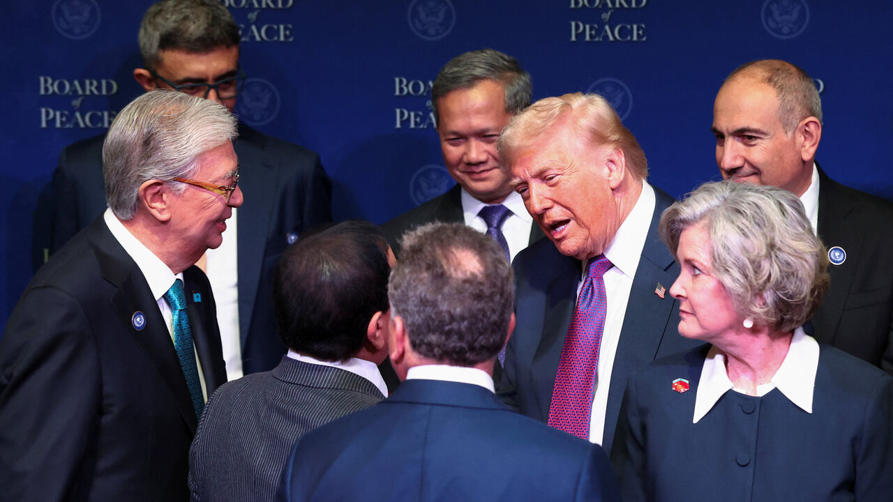 U.S President Donald Trump talks with world leaders participating in the inaugural Board of Peace meeting at the U.S. Institute of Peace in Washington, D.C., U.S., February 19, 2026. REUTERS/Kevin Lamarque