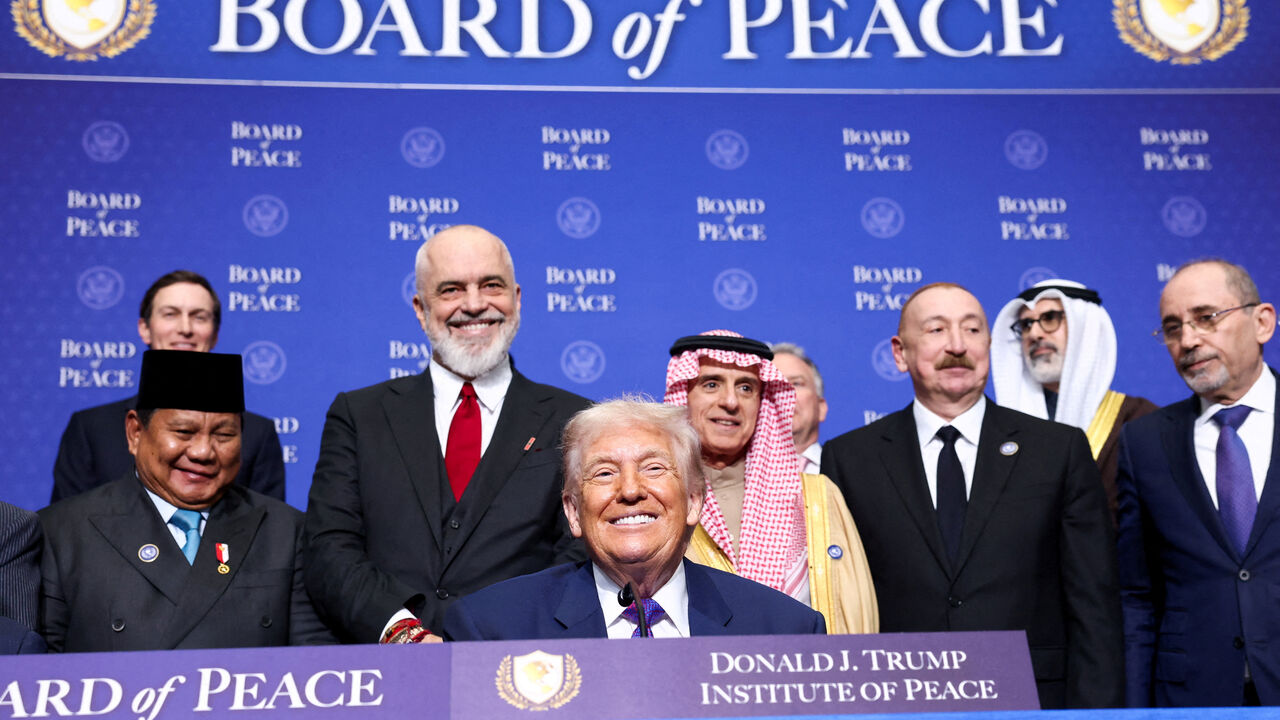FILE PHOTO: U.S President Donald Trump, Indonesia's President Prabowo Subianto, Albania's Prime Minister Edi Rama, Saudi Minister of State for Foreign Affairs, Cabinet Member, and Climate Envoy Adel Al-Jubeir, Azerbaijani President Ilham Aliyev, and Jordan's Foreign Minister Ayman Safadi attend the inaugural Board of Peace meeting at the U.S. Institute of Peace in Washington, D.C., U.S., February 19, 2026. REUTERS/Kevin Lamarque/File Photo