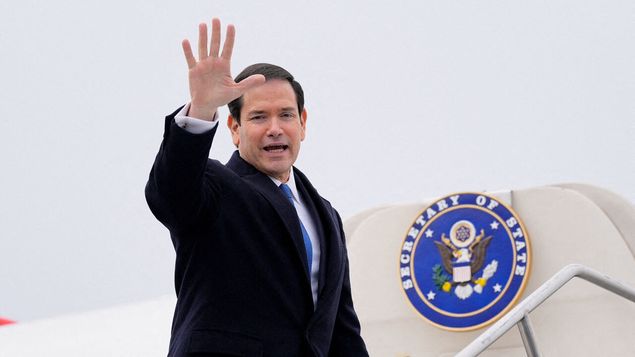FILE PHOTO: U.S. Secretary of State Marco Rubio waves as he departs at the Liszt Ferenc International Airport in Budapest, Hungary, February 16, 2026.     Alex Brandon/Pool via REUTERS/File Photo