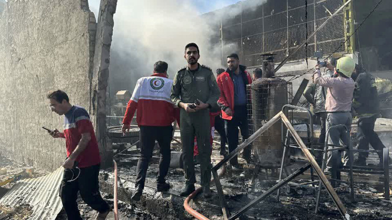 Rescue forces work at the site of an Iranian army helicopter crash in a fruit market in Isfahan, Iran, February 24, 2026. Iranian Red Crescent/WANA (West Asia News Agency)/Handout via REUTERS