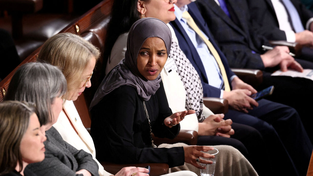 FILE PHOTO: U.S. Representative Ilhan Omar listens as U.S. President Donald Trump delivers the State of the Union address in the House Chamber of the U.S. Capitol in Washington, D.C., U.S., February 24, 2026.  REUTERS/KEVIN LAMARQUE/File Photo