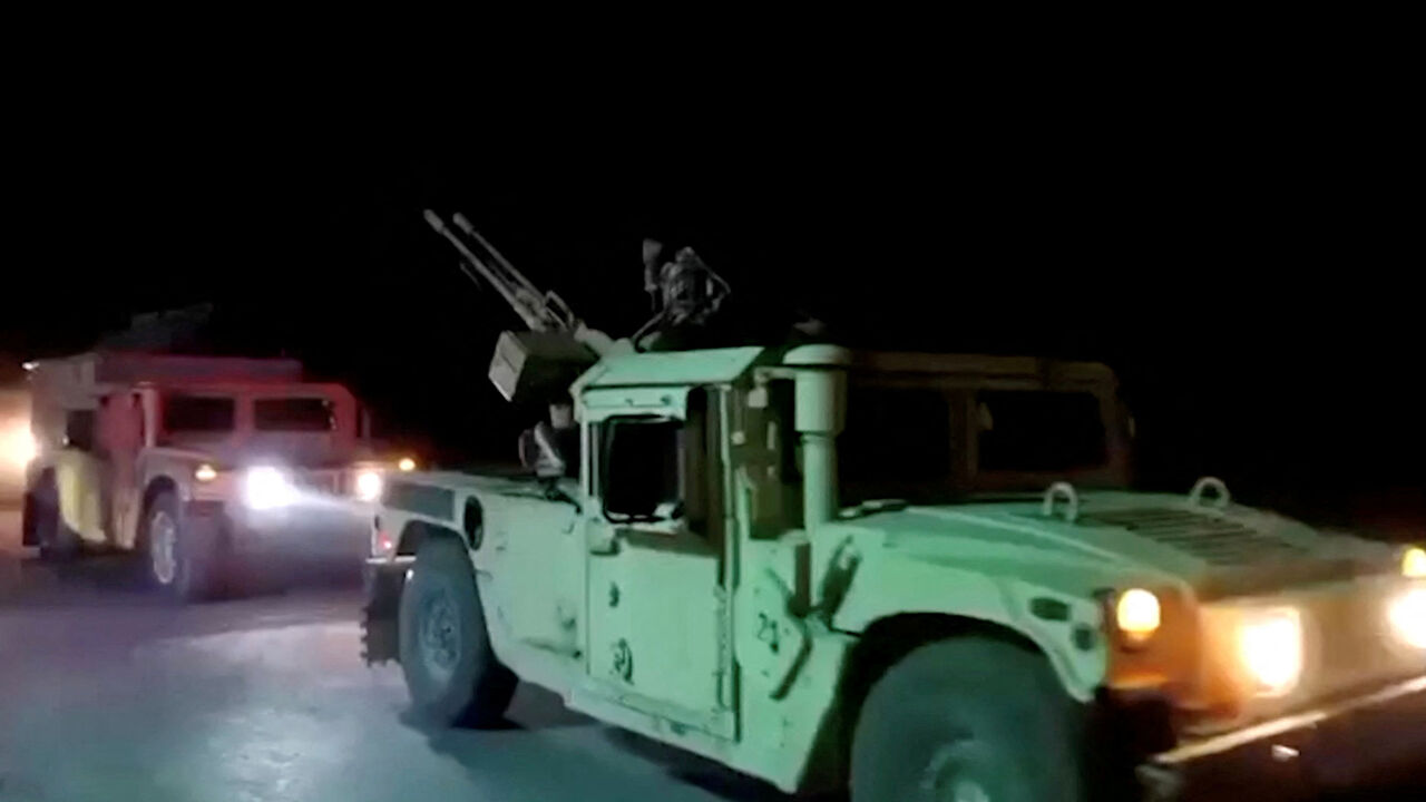 Military vehicles move on a road in a location given as Nangarhar, Afghanistan, in this screengrab from a handout video released on February 26, 2026. Pakistani and Afghan border forces clashed on Thursday night after the Taliban launched what it called retaliatory strikes on Pakistani installations, sharply escalating tensions after days of cross-border hostilities.   Afghanistan's Ministry of Defense/Handout via REUTERS