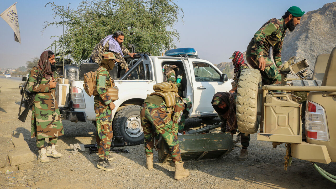 Taliban soldiers load ammunition in a vehicle, following exchanges of fire between Pakistan and Afghanistan forces, near Torkham border, in Afghanistan, February 27, 2026. REUTERS/Stringer