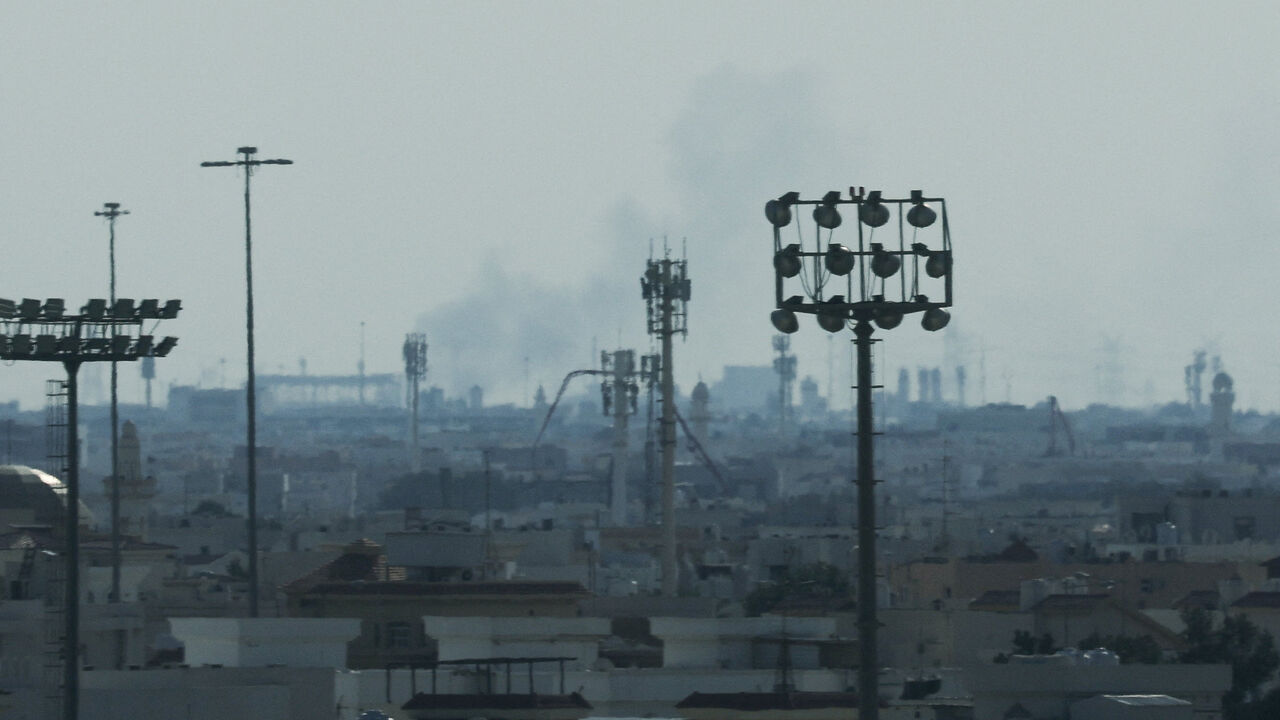 Smoke is left in the sky after reported Iranian missile attacks, following strikes by the United States and Israel against Iran, as seen from Doha, Qatar, February 28, 2026. REUTERS/Mohammed Salem
