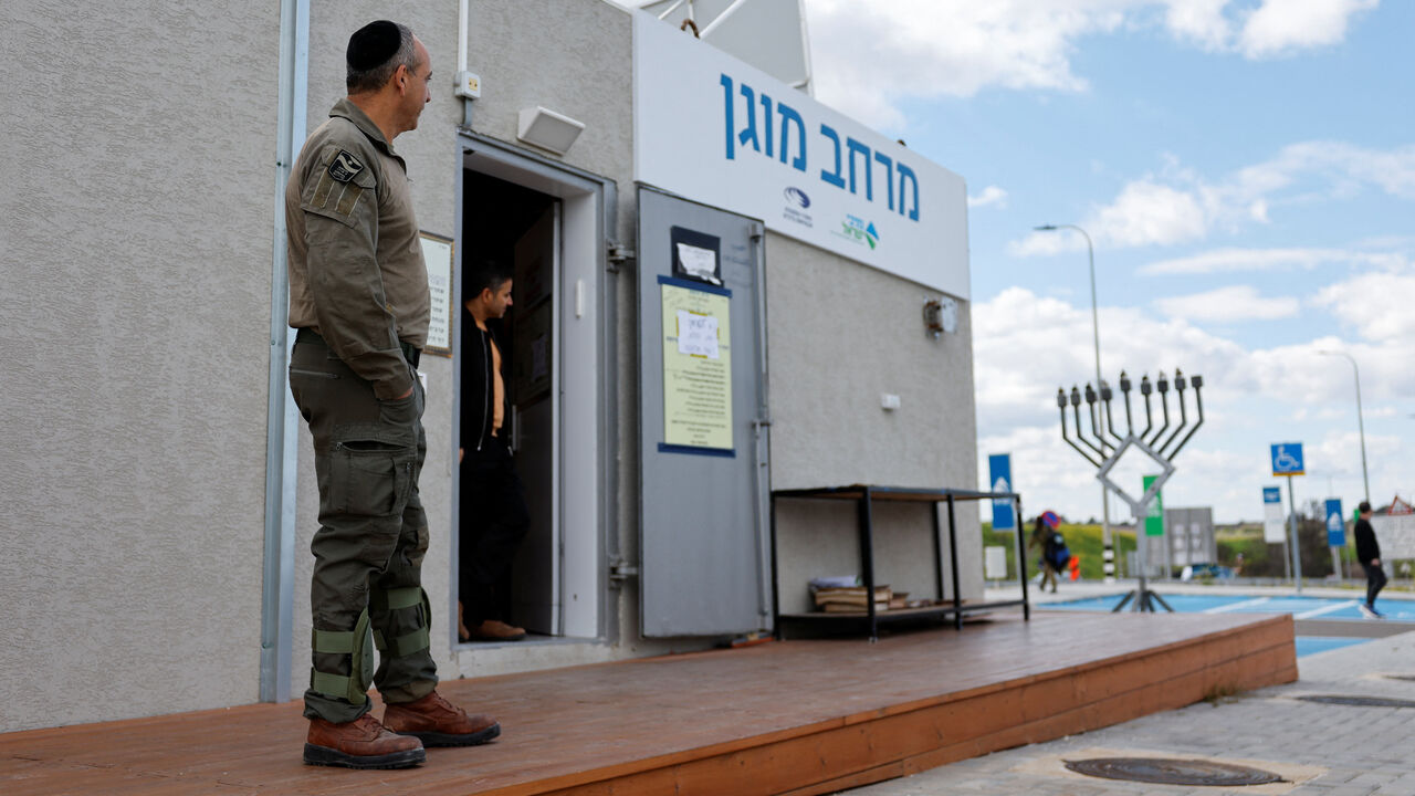 An Israeli security personnel stands by a protected area after missiles were launched towards Israel from Iran following strikes by Israel and the U.S. on Iran, in Latrun, Israel, February 28, 2026. REUTERS/Amir Cohen
