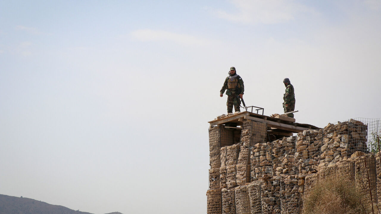 Taliban soldiers stand on top of a their post as they guard near the Pakistan-Afghanistan border, in Khost province, Afghanistan, February 27, 2026. REUTERS/Stringer