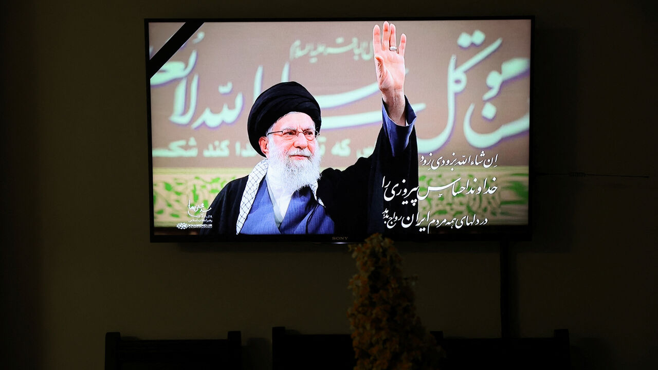 A photo of the late Iranian Supreme Leader Ayatollah Ali Khamenei is shown on TV when the news of his death is announced, in Tehran, Iran March 1, 2026. Majid Asgaripour/WANA (West Asia News Agency) via REUTERS