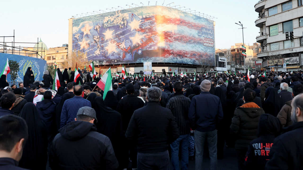 People react as they gather at the Enghelab Square, after Iran's Supreme Leader Ayatollah Ali Khamenei was killed in Israeli and U.S. strikes on Saturday, in Tehran, Iran, March 1, 2026. Majid Asgaripour/WANA (West Asia News Agency) via REUTERS