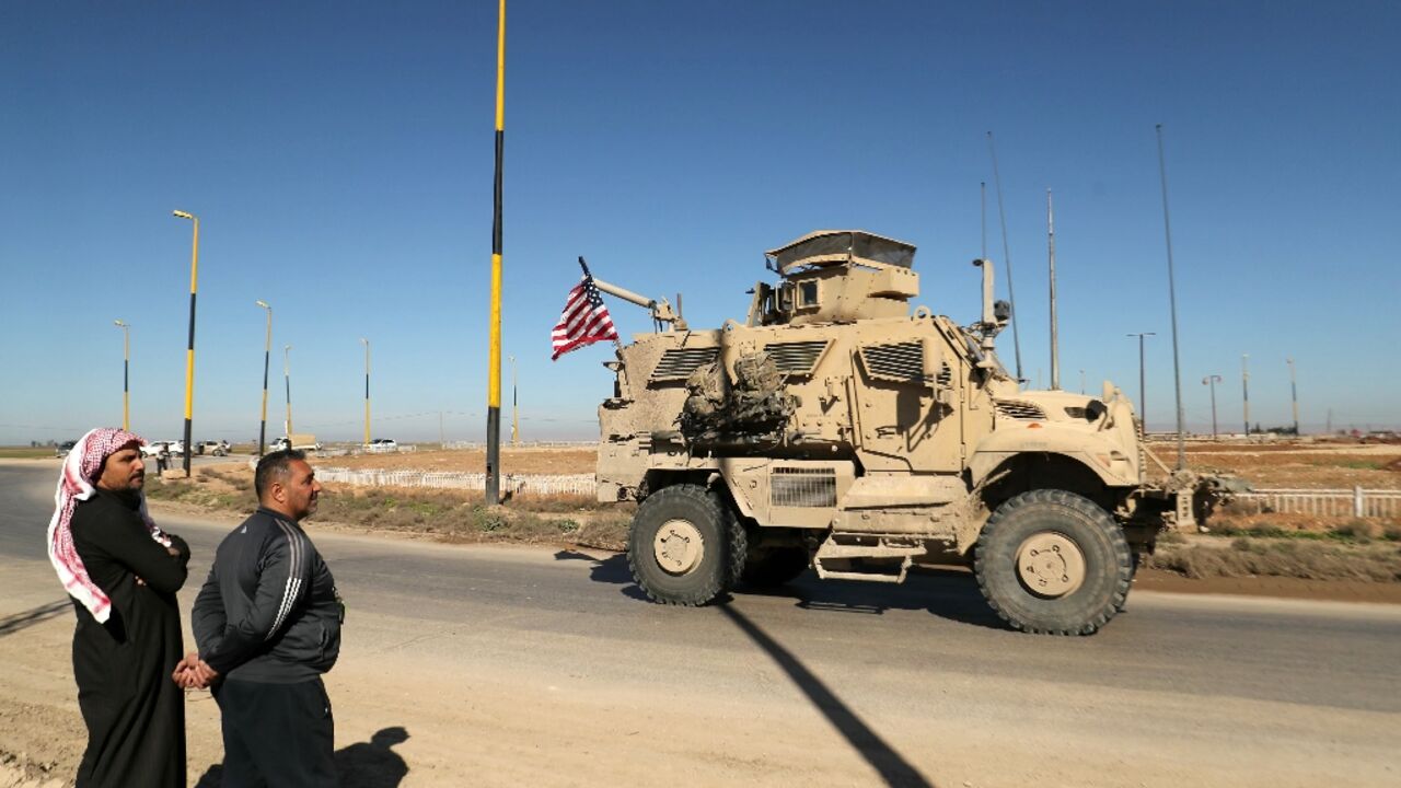 A US military vehicle in northeastern Syria driving towards the Iraqi border