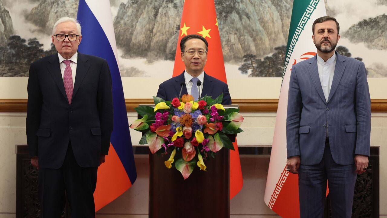 (L-R) Russian Deputy Foreign Minister Sergei Ryabkov, Chinese Executive Vice Minister of Foreign Affairs Ma Zhaoxu, and Iranian Deputy Foreign Minister Kazem Gharibabadi hold a press conference after their meeting in Beijing on March 14, 2025.