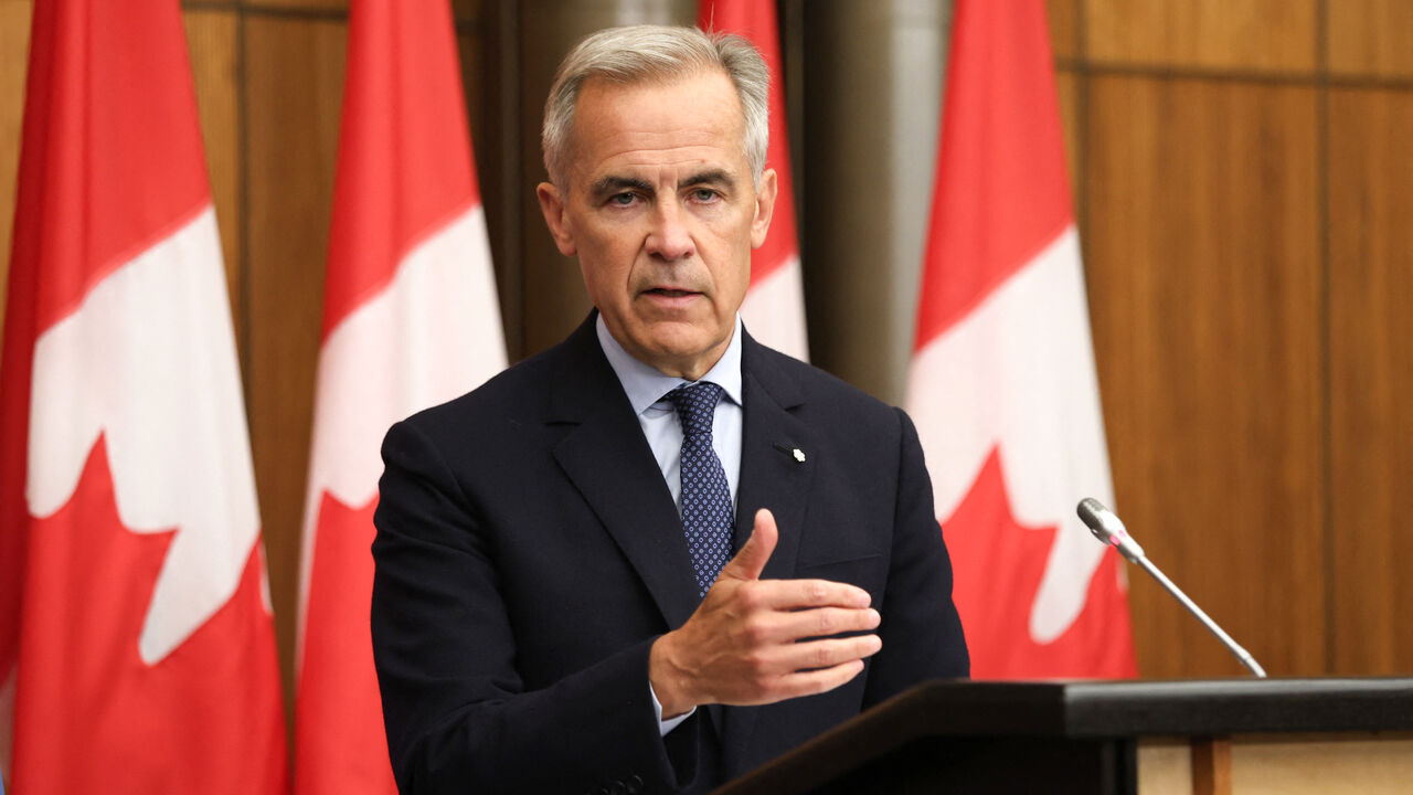 Canadian Prime Minister Mark Carney speaks during a press conference after a Cabinet meeting to discuss both trade negotiations with the US and the situation in the Middle East, at the National Press Theatre in Ottawa, Ontario, Canada on July 30, 2025. Canada "intends" to recognize a Palestinian state at the UN General Assembly in September, Prime Minister Mark Carney said Wednesday, a dramatic policy shift he said was necessary to preserve hopes of a two-state solution. (Photo by Dave CHAN / AFP) (Photo by