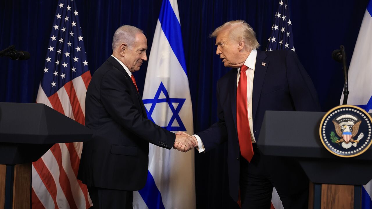 US President Donald Trump shakes hands with Israeli Prime Minister Benjamin Netanyahu during a press conference at his Mar-a-Lago club on Dec. 29, 2025, in Palm Beach, Florida.