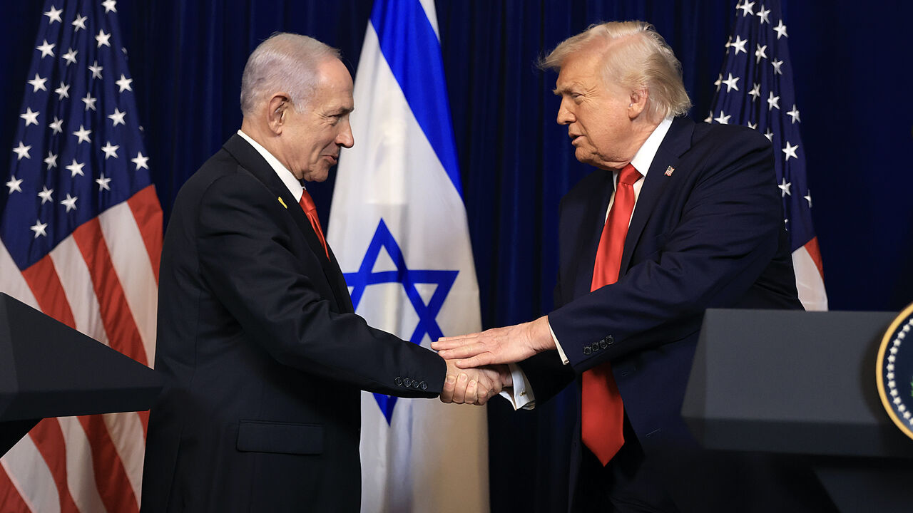 US President Donald Trump shakes hands with Israeli Prime Minister Benjamin Netanyahu during a press conference at his Mar-a-Lago club on Dec. 29, 2025 in Palm Beach, Florida. 