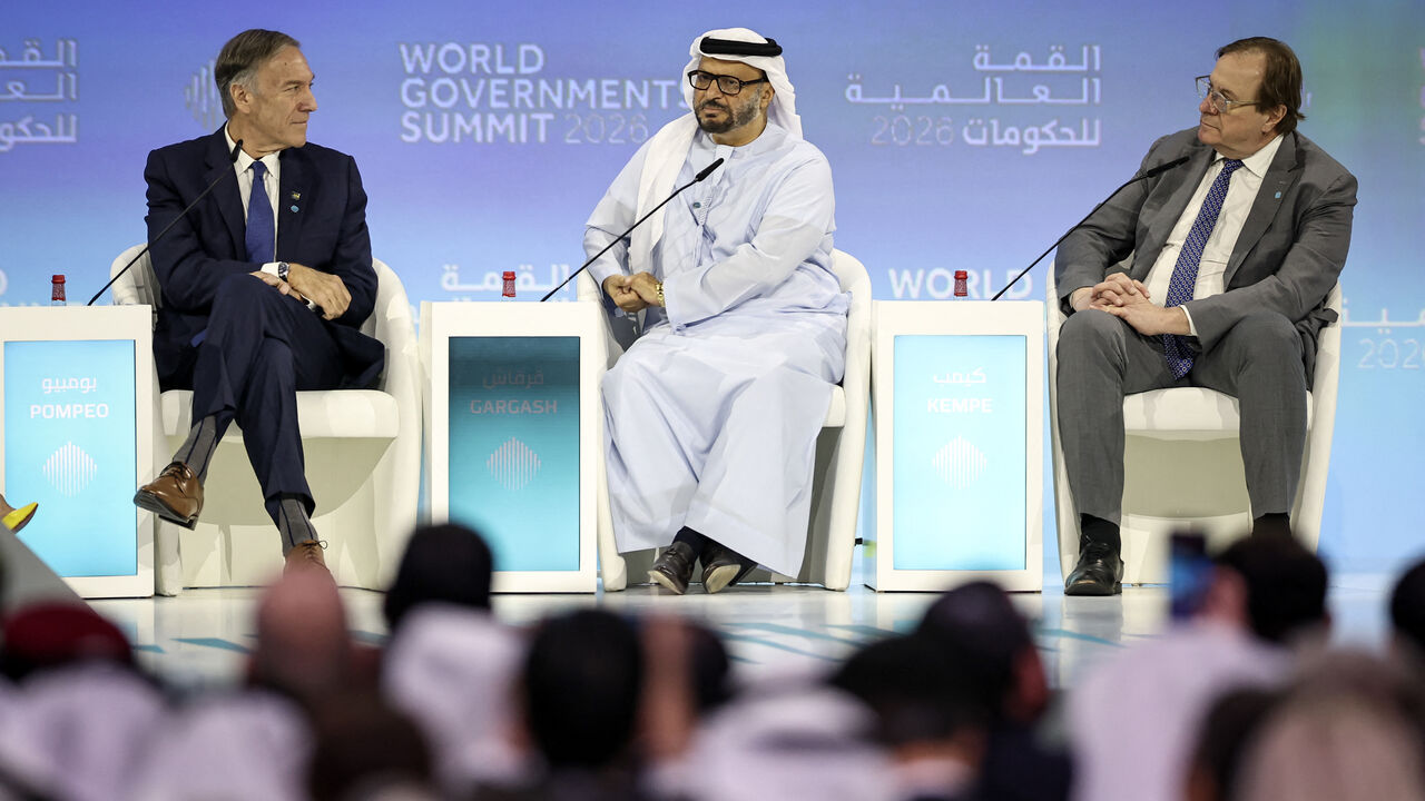 Diplomatic advisor to the United Arab Emirates President Anwar Gargash (C) react on stage with Former US Secretary of State Mike Pompeo (L) and Atlantic Council President and CEO Frederick Kempe (R) during the World Governments Summit in Dubai on February 3, 2026. Spain will seek to ban social media for under-16s to protect them from harmful content such as pornography and violence, Prime Minister Pedro Sanchez said on February 3, in the latest such move by governments. Australia established a world first i