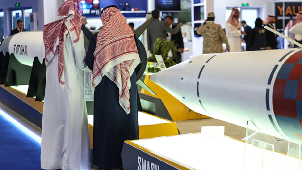 Visitors stand in front of a Fatah-II guided rocket (L) and a SMASH anti-ship missile during the World Defence Show in Riyadh on February 9, 2026. (Fayez Nureldine / AFP via Getty Images)