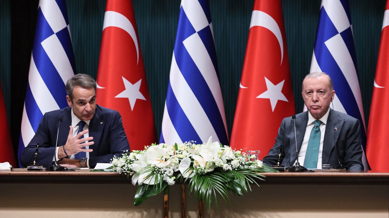 Greek Prime Minister Kyriakos Mitsotakis (L) gestures as he addresses the media during a joint press conference with Turkish President Recep Tayyip Erdogan (R) at the Presidential Complex in Ankara, on Feb. 11, 2026. 