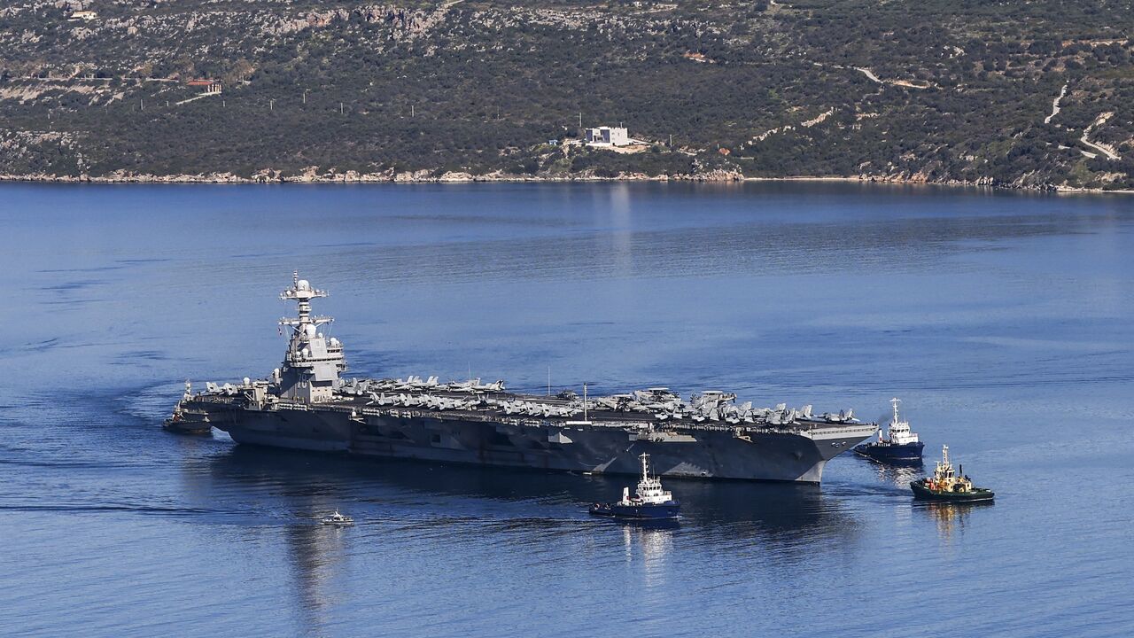 The US Navy aircraft carrier USS Gerald R. Ford departs Souda Bay on the island of Crete, on Feb. 26, 2026.