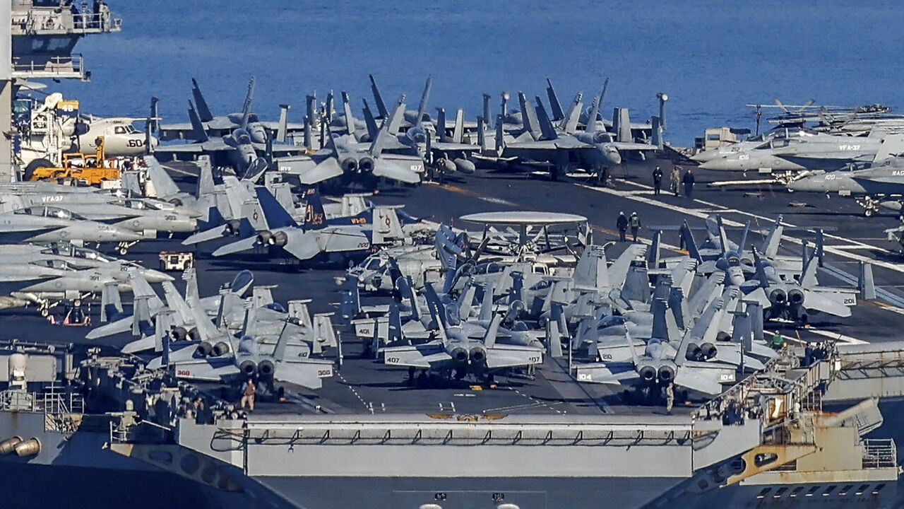 The US Navy aircraft carrier USS Gerald R. Ford departs Souda Bay on the island of Crete on February 26, 2026. (Photo by Costas METAXAKIS / AFP via Getty Images)