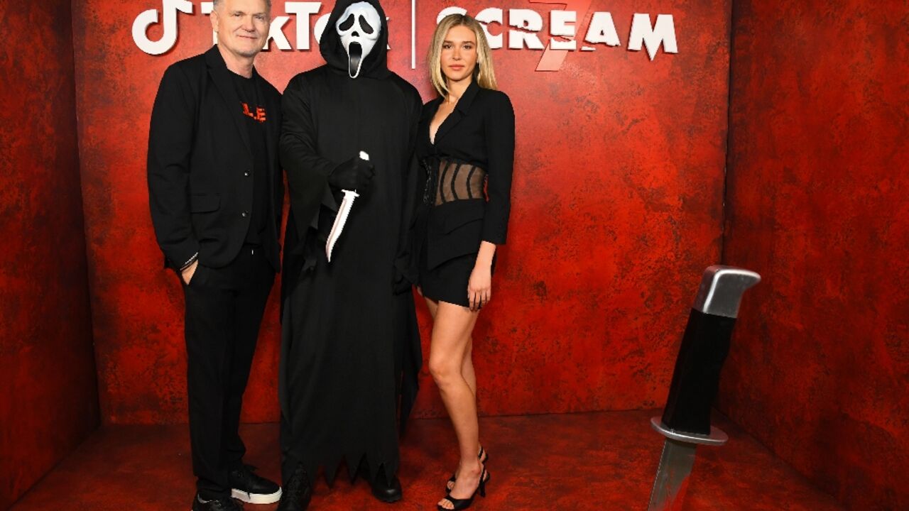 Kevin Williamson at a Scream 7 promotional event in Los Angeles with actress Isabel May 