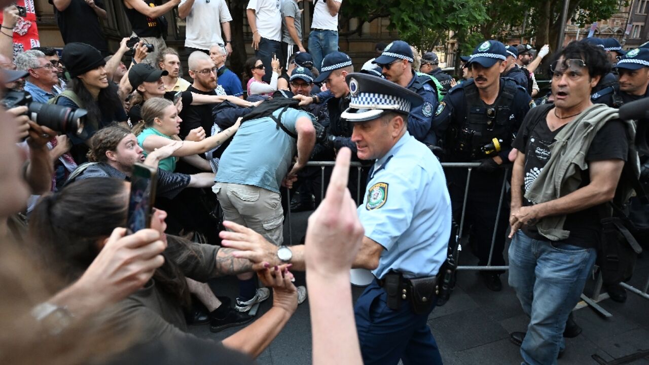 Police scuffle with pro-Palestinian protesters during a demonstration in Sydney against Israeli President Isaac Herzog's visit to Australia