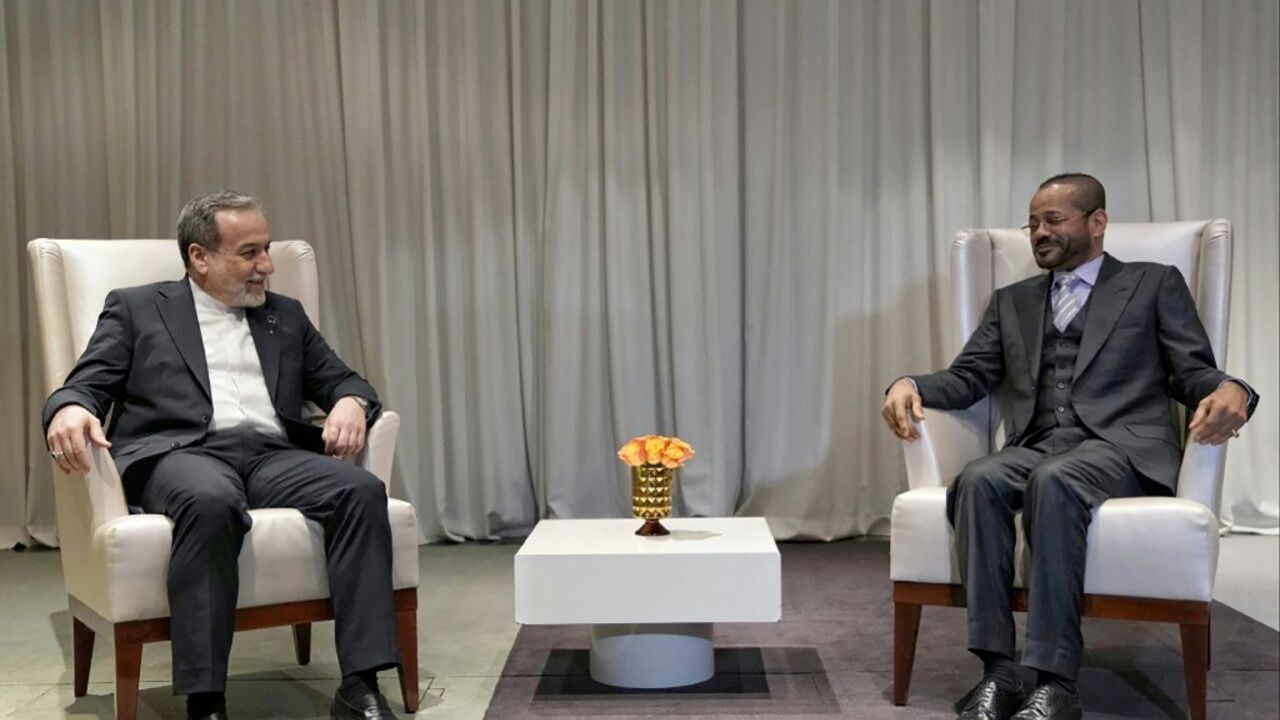 Iranian Foreign Minister Abbas Araghchi (L) meets with his Omani counterpart Badr Albusaidi in Geneva ahead of fresh negotiations with the US