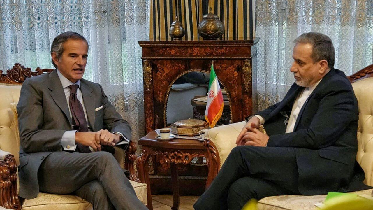 In this handout photo released by the Iranian Ministry of Foreign Affairs, Iran's Foreign Minister Abbas Araghchi holds a meeting with International Atomic Energy Agency head Rafael Grossi in Geneva