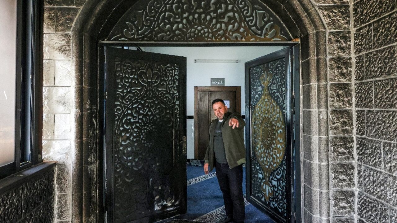 The burnt entrance of the Abu Bakr al-Siddiq Mosque in the West Bank village of Tell