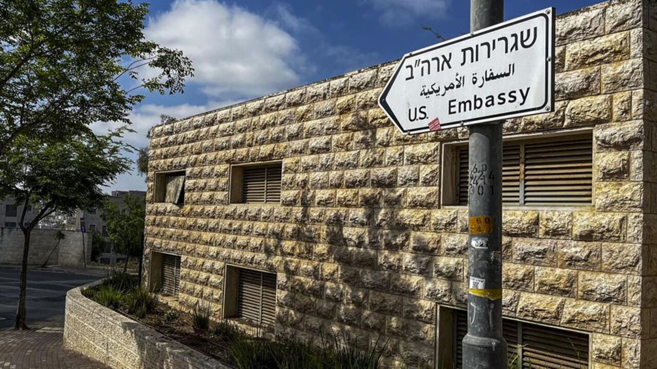A road sign shows the way toward the US Embassy in Jerusalem on April 19, 2024. — Ronald Schemidt/Getty/AFP