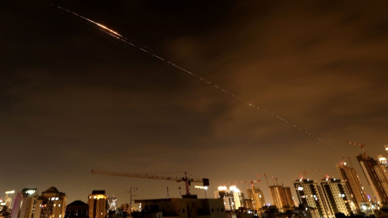 Rocket trails seen in the sky above the Israeli coastal city of Netanya early on Monday