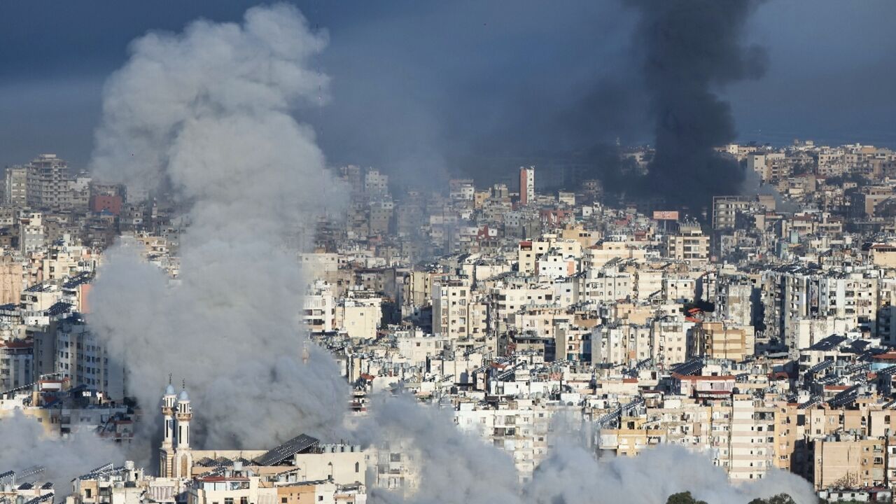 Plumes of smoke rise from the sites of Israeli airstrikes on the southern suburbs of Beirut