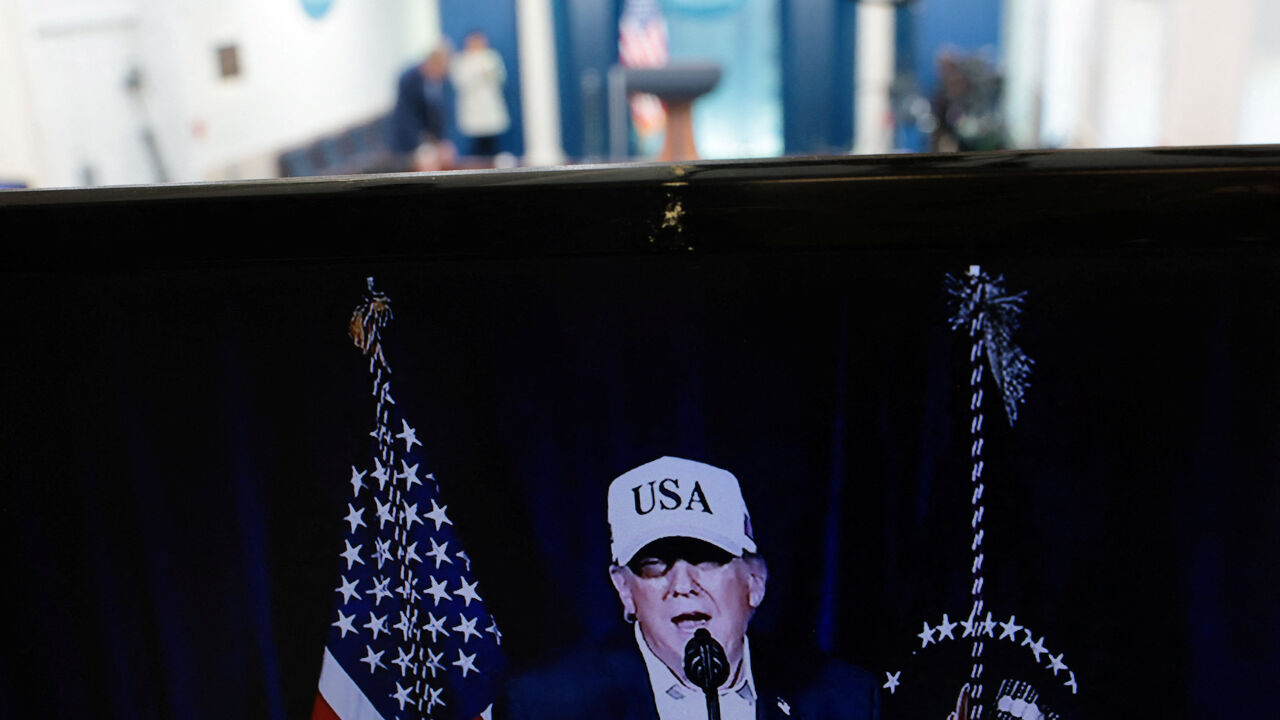 A television monitor shows U.S. President Donald Trump's earlier announcement in the otherwise empty press briefing room at the White House, while U.S. President Trump is away at his Mar-a-lago Club in Palm Beach, Florida, on the day the United States and Israel led attacks on Iran, in Washington, D.C., U.S., February 28, 2026. REUTERS/Jonathan Ernst
