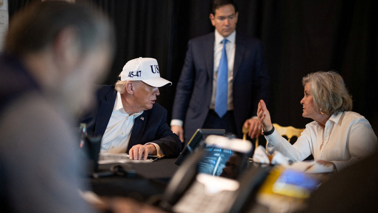 U.S. President Donald Trump speaks with White House Chief of Staff Susie Wiles and Secretary of State Marco Rubio during military operations in Iran, at Trump's Mar-a-Lago resort in Palm Beach, Florida, U.S. February 28, 2026.  The White House/Social Media/Handout via REUTERS