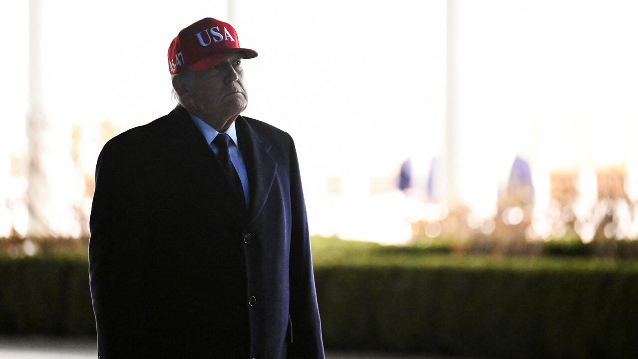 U.S. President Donald Trump looks at statues in the Rose Garden while returning to the White House, after Israel and the U.S. launched strikes on Iran, in Washington, D.C., U.S., March 1, 2026. REUTERS/Annabelle Gordon