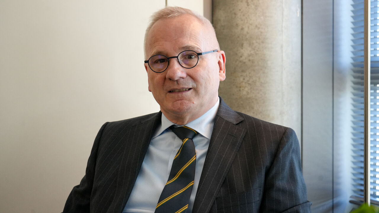 Robert in den Bosch, the Disarmament Ambassador and Permanent Representative to the Conference on Disarmament of the Kingdom of the Netherlands in Geneva, and Chair of the Convention on Certain Conventional Weapons Group of Governmental Experts on Emerging Technologies in Lethal Autonomous Weapons Systems, sits at a desk in his office in Geneva, Switzerland February 25, 2026. REUTERS/Olivia Le Poidevin