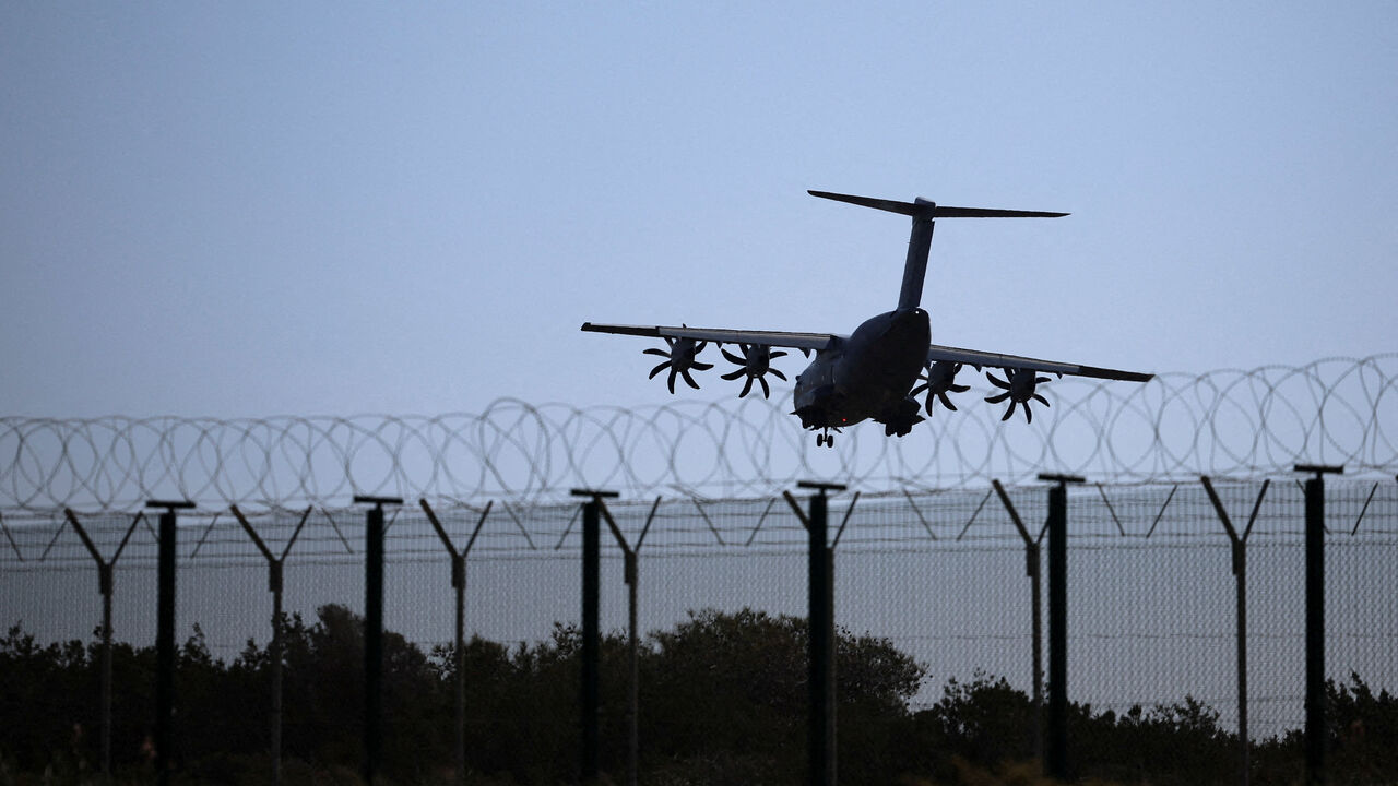 An aircraft prepares to land in RAF Akrotiri, a British sovereign base in Cyprus that was hit by a drone early Monday, causing limited damage, in Cyprus. REUTERS/Yiannis Kourtoglou