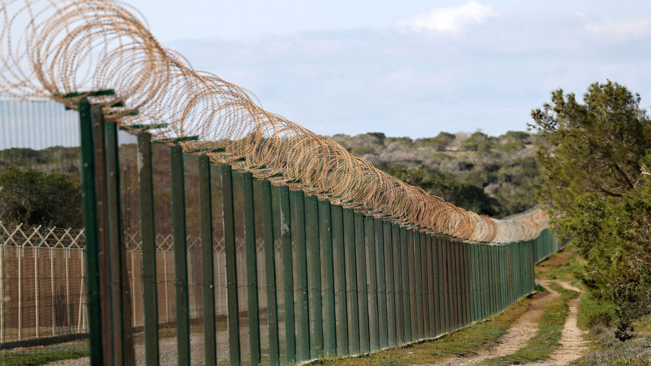 A fence at the entrance of RAF Akrotiri, a British sovereign base in Cyprus that was hit by a drone early Monday, causing limited damage, in Cyprus March 4, 2026. REUTERS/Yiannis Kourtoglou