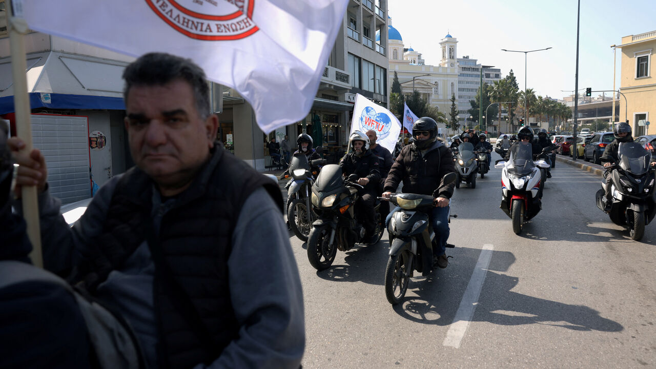 Greek seafarers participate at a motorcycle protest, as they move towards the Ministry of Maritime Affairs and Insular Policy to demand the return of crews stranded aboard commercial vessels in the Strait of Hormuz following the widening Iran conflict, in Piraeus, Greece, March 5, 2026. REUTERS/Louiza Vradi