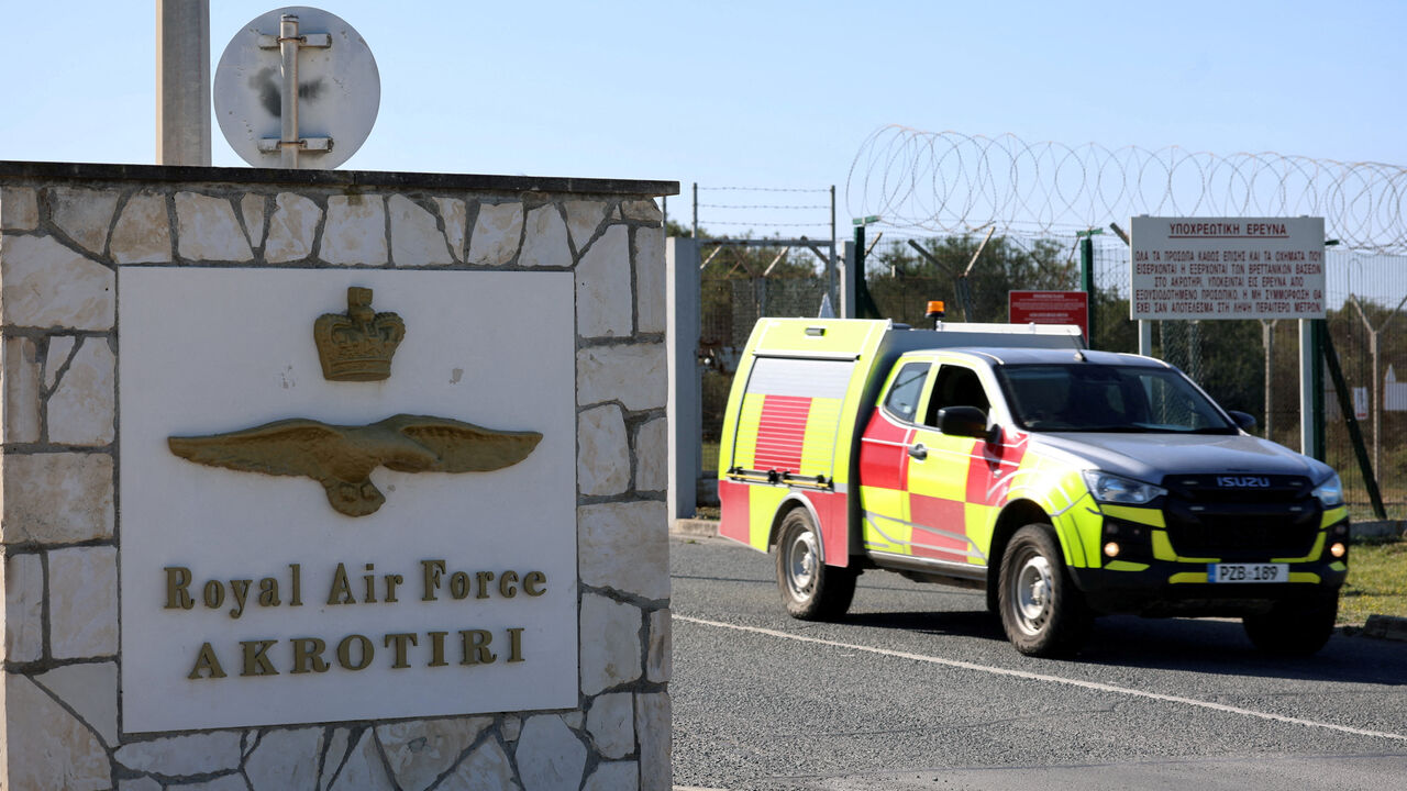 FILE PHOTO: A car drives out of the entrance of RAF Akrotiri, a British sovereign base in the country, as the conflict in the Middle East intensifies, Cyprus March 5, 2026. REUTERS/Yiannis Kourtoglou/File Photo