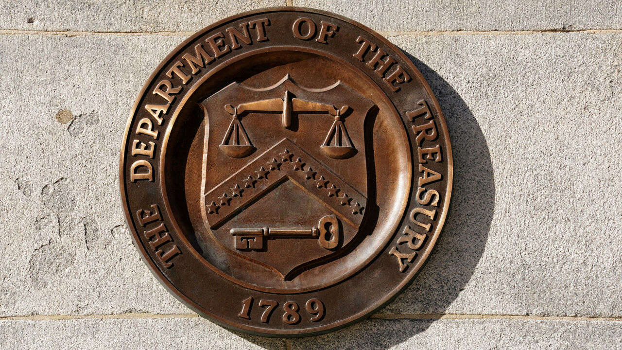 FILE PHOTO: A bronze seal for the Department of the Treasury is shown at the U.S. Treasury building in Washington, U.S., January 20, 2023. REUTERS/Kevin Lamarque/File Photo
