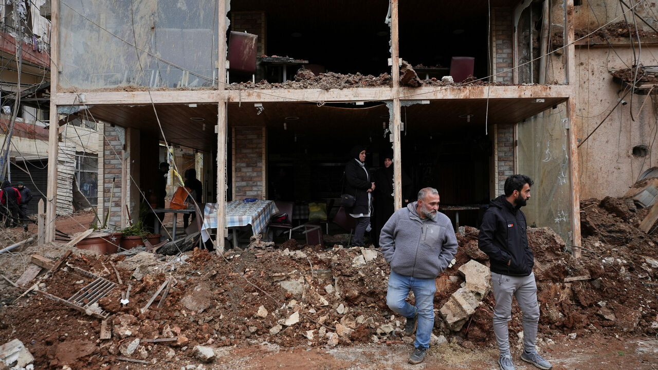 People inspect the damage where Israel's military carried out an airborne operation that dropped troops overnight in the town of Nabi Chit, Lebanon, March 7, 2026. REUTERS/ Mohammad Yassine