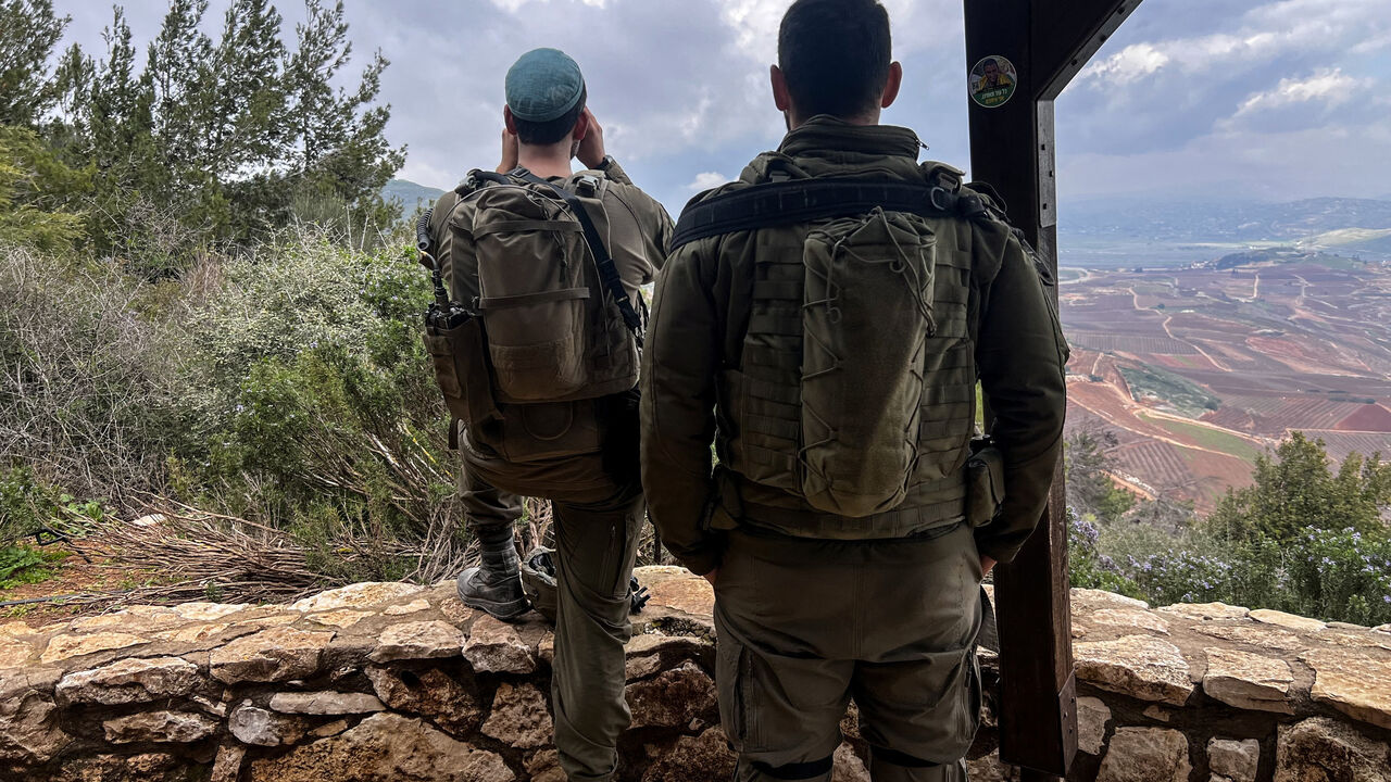 Israeli soldiers look towards Lebanon, amid an escalation between Iran-backed Hezbollah and Israel, and amid the U.S.-Israeli conflict with Iran, by the Israel-Lebanon border in northern Israel March 7, 2026. REUTERS/Avi Ohayon