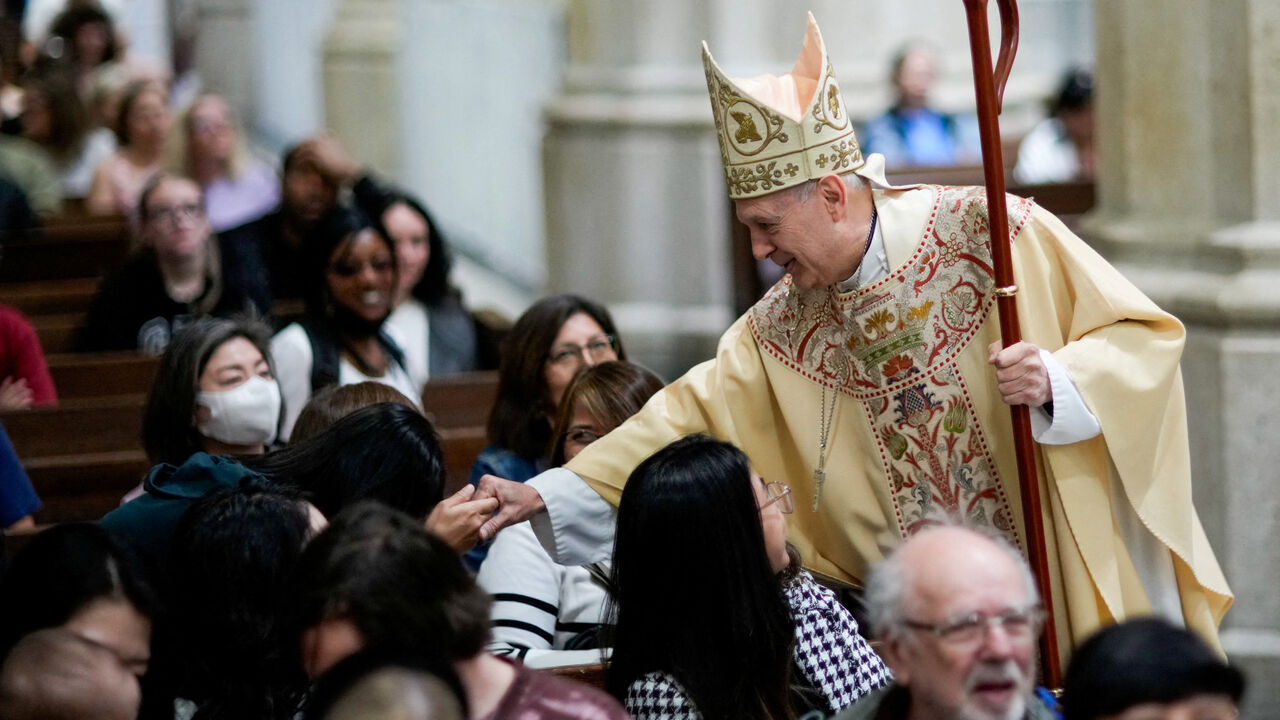 Archbishop Gabriele Caccia, permanent observer of the Holy See to the United Nations, greets parishioners before Mass for the late Pope Francis, at St. Patrick's Cathedral in New York City, U.S., April 26, 2025. REUTERS/Eduardo Munoz/File Photo