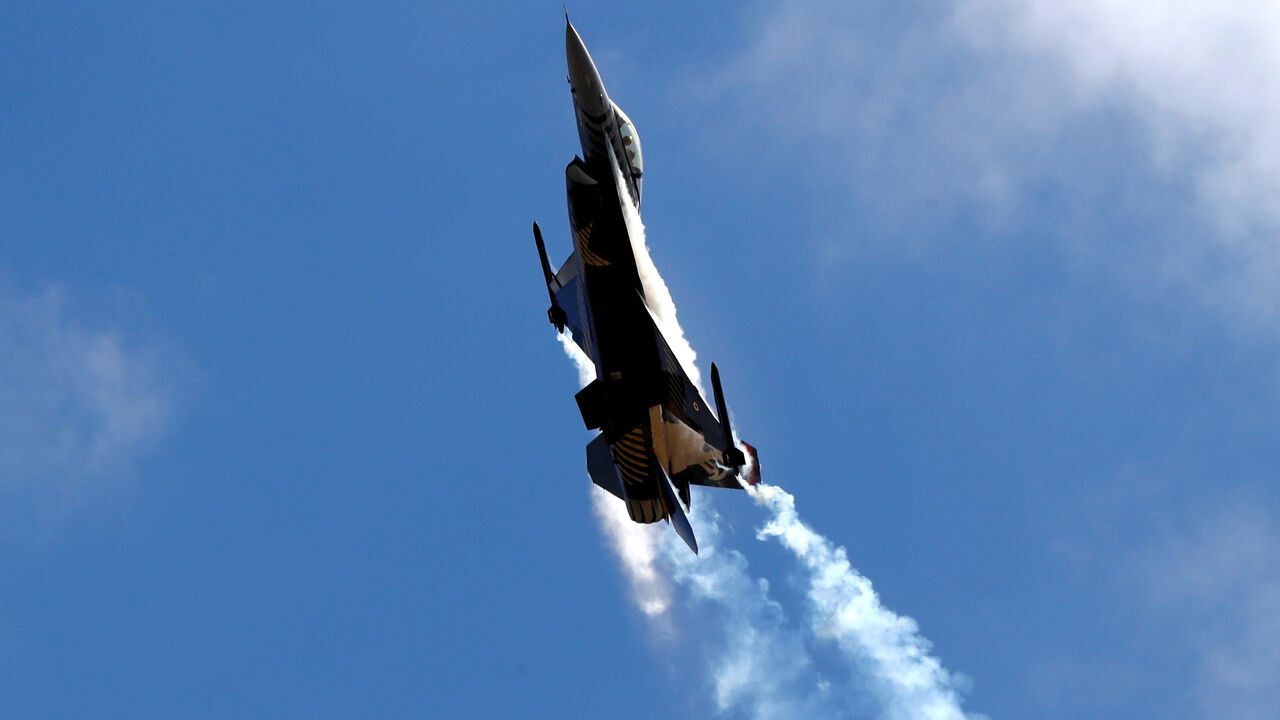 An F-16 aircraft of the Turkish Stars aerobatic team of the Turkish Air Force performs during Teknofest airshow over the city's new airport under construction in Istanbul, Turkey September 20, 2018. REUTERS/Osman Orsal/File Photo