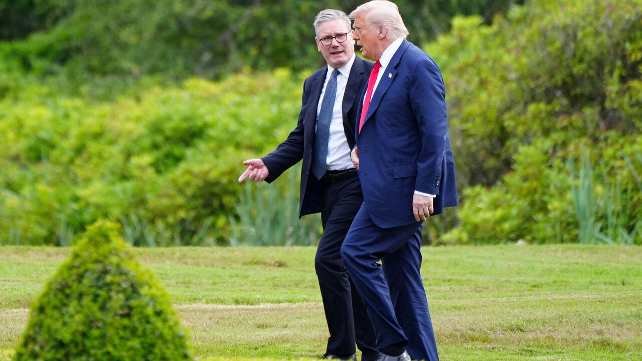 FILE PHOTO: U.S. President Donald Trump walks with British Prime Minister Keir Starmer at Trump International Golf Links, in Aberdeen, Scotland, Britain, July 28, 2025.    Jane Barlow/Pool via REUTERS/File Photo