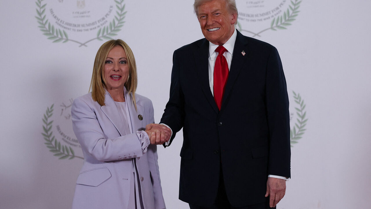 FILE PHOTO: U.S. President Donald Trump and Italian Prime Minister Giorgia Meloni shake hands as they pose for a photo, at a world leaders' summit on ending the Gaza war, amid a U.S.-brokered prisoner-hostage swap and ceasefire deal between Israel and Hamas, in Sharm el-Sheikh, Egypt, October 13, 2025. REUTERS/Suzanne Plunkett/Pool/ File Photo