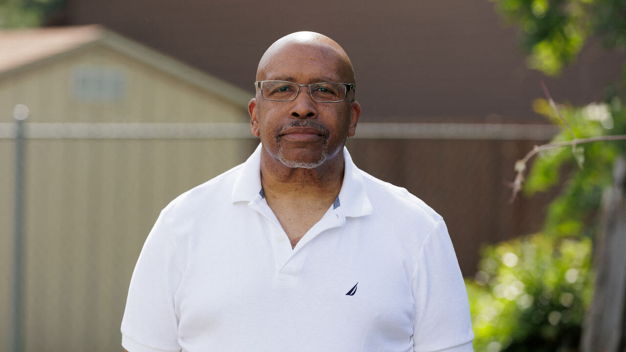 FILE PHOTO: Herman Sims, trucking night operations manager, poses for a portrait outside of his home in Dallas, Texas, U.S., May 13, 2025. REUTERS/Shelby Tauber/File Photo