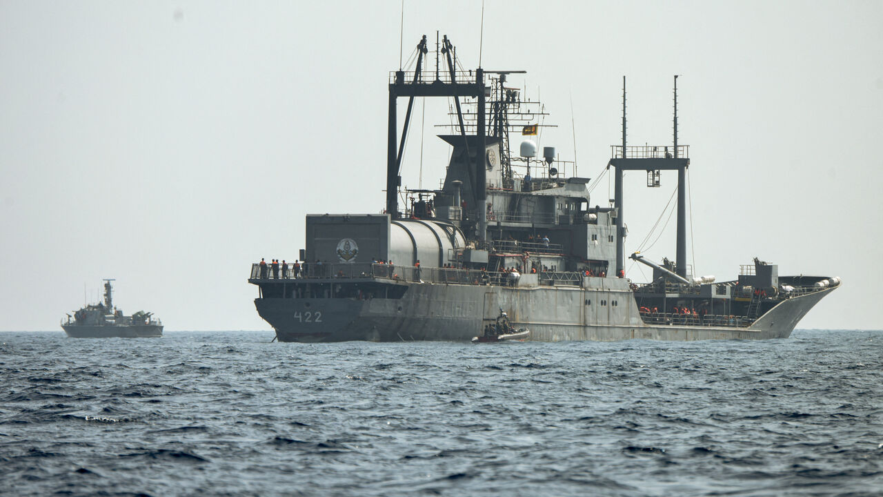 FILE PHOTO: A Sri Lanka Navy vessel approaches an Iranian vessel during a rescue operation, a day after the crew of a distressed Iranian military ship, IRIS Dena were assisted in waters south of Sri Lanka, off the coast of Colombo, Sri Lanka March 5, 2026. Sri Lanka Navy/Handout via REUTERS/File Photo