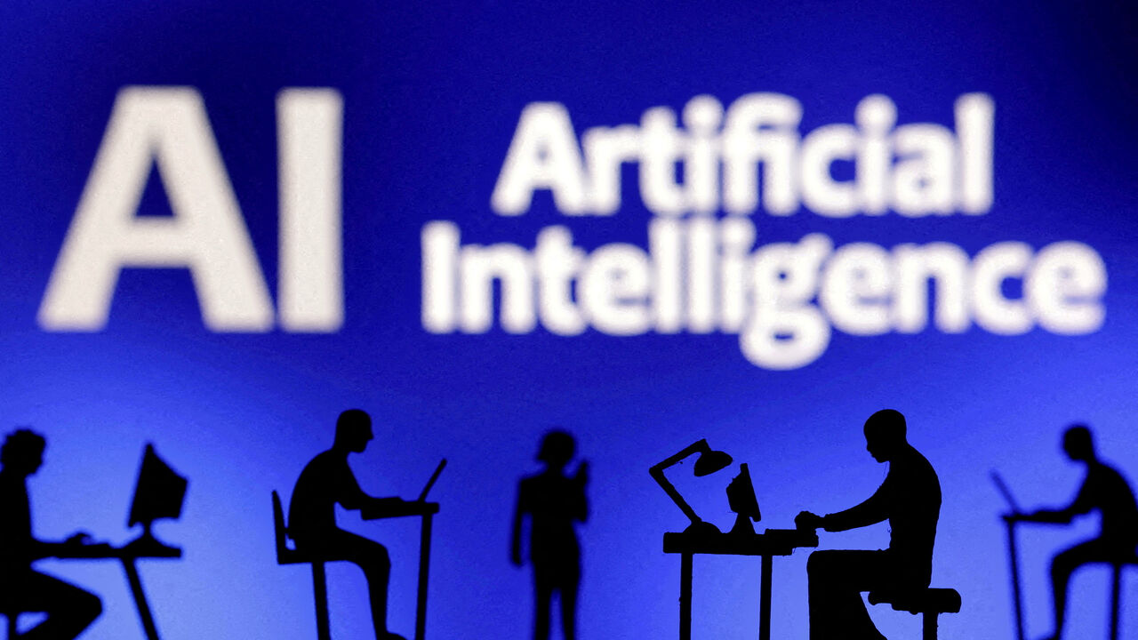 FILE PHOTO: Figurines with computers and smartphones are seen in front of the words "Artificial Intelligence AI" in this illustration created on February 19, 2024. REUTERS/Dado Ruvic/File Photo